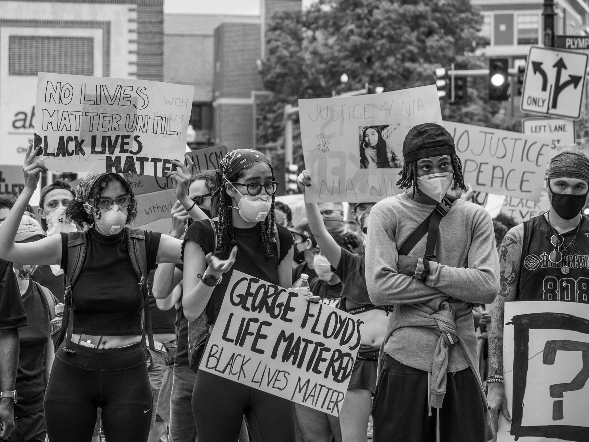 Protesters holding Black Lives Matter signs