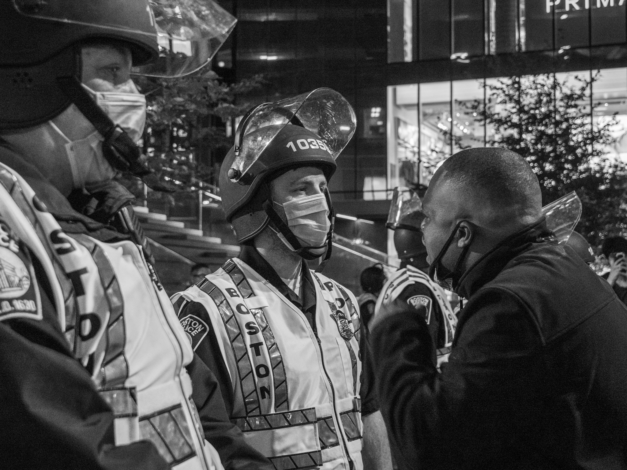 Protester face to face with Boston Police at night