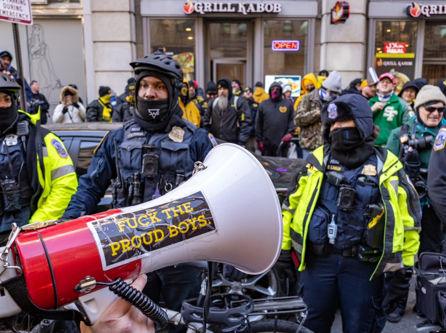 Counter-protester megaphone facing police, D.C.