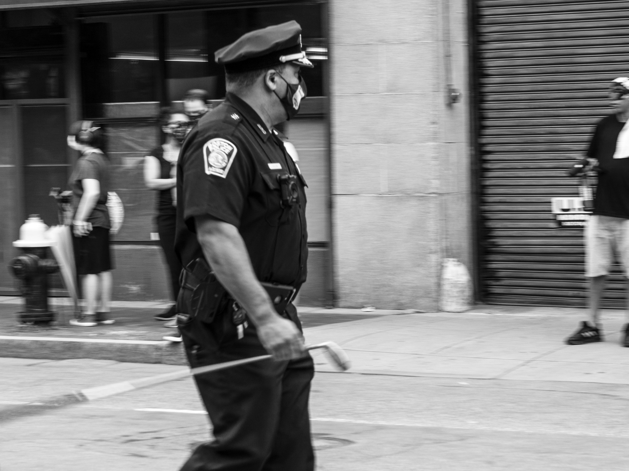 Officer walking with baton
