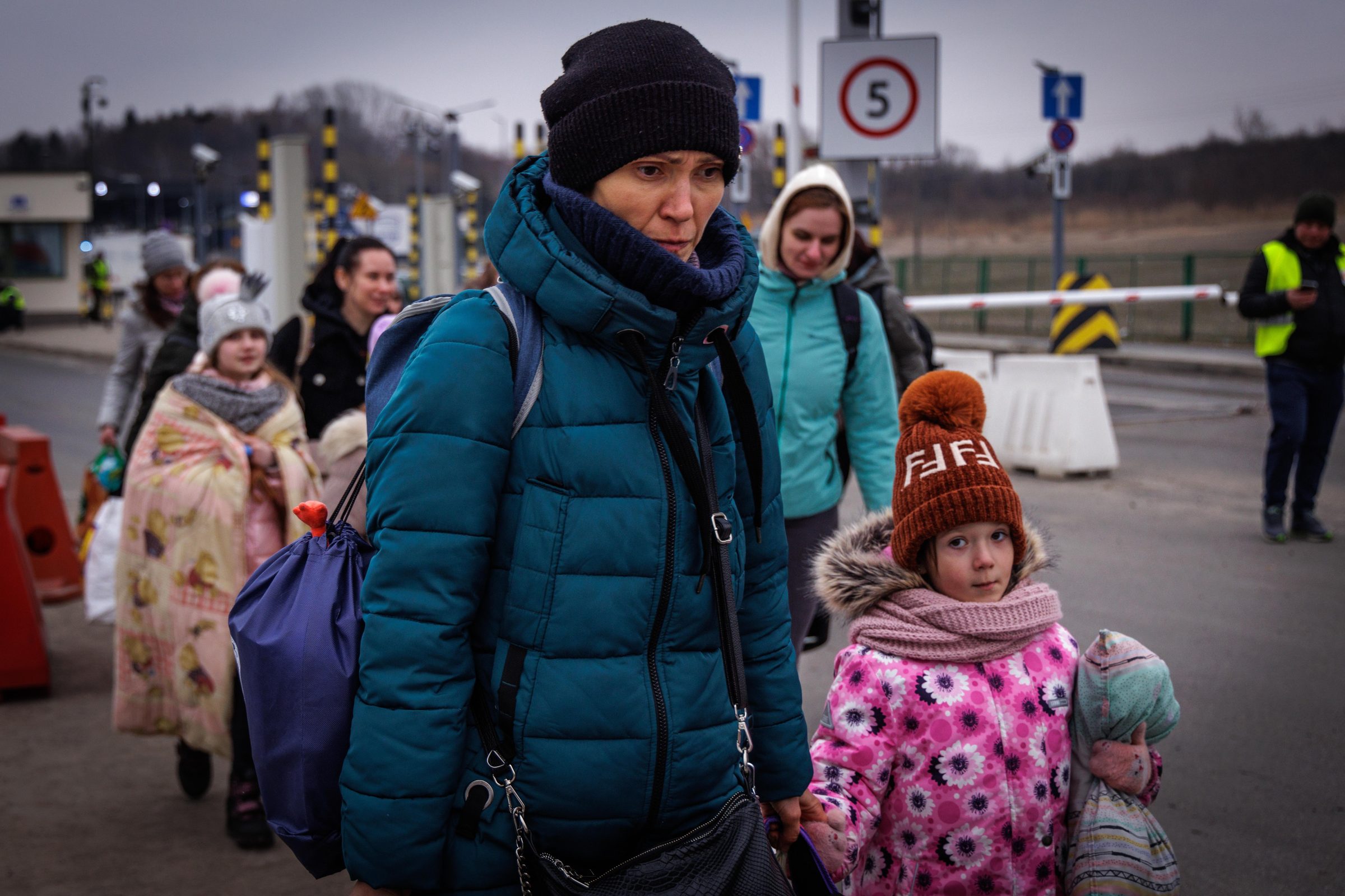 Mother and daughter crossing the border